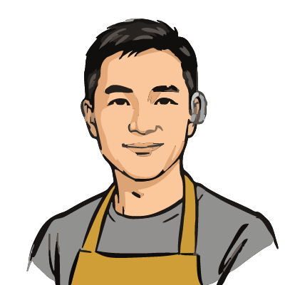 A Korean man about 34 with light warm skin, short black hair, a clearly visible silver-gray behind-the-ear hearing aid hooked over his right ear, a mustard-yellow apron over a gray t-shirt. Brush ink style.